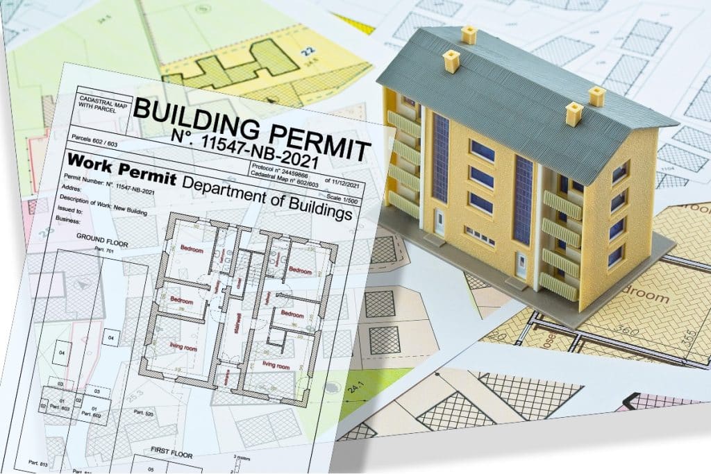 concept de permis de construire avec plan urbain et un batiment